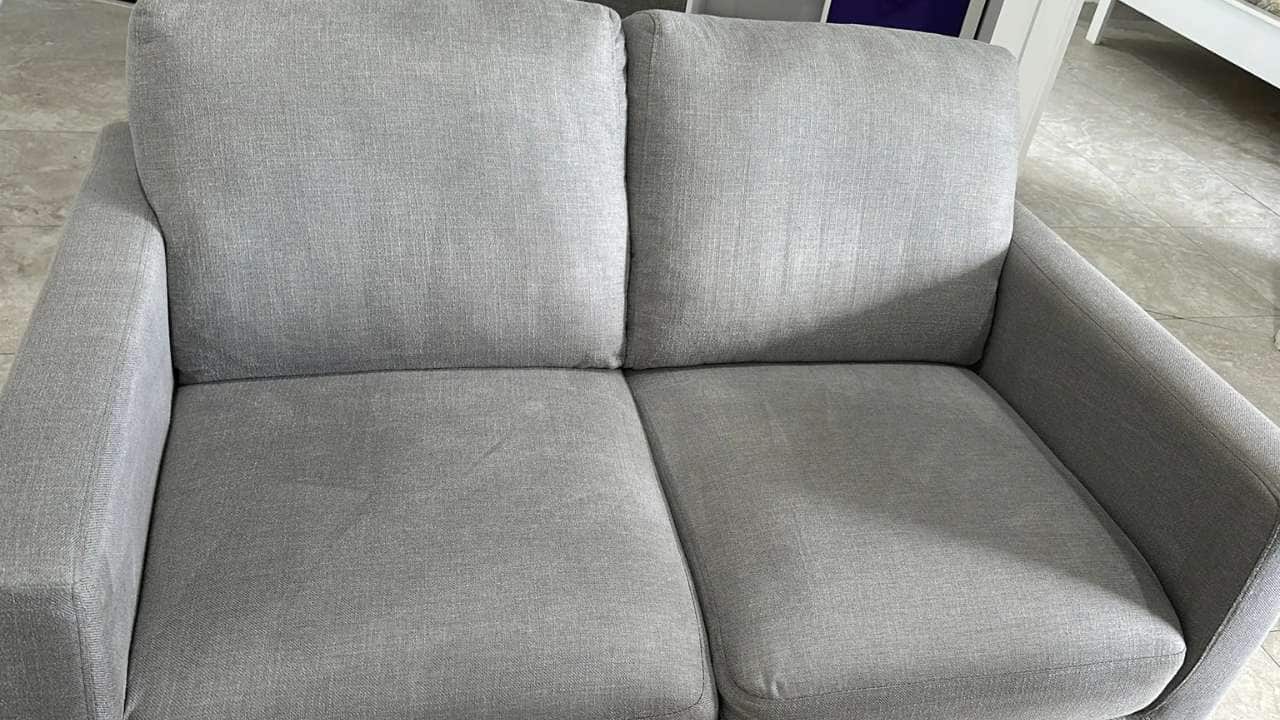 Couch looking clean and refreshed after professional cleaning